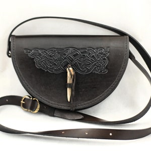 Semicircular shoulder bag, fastened with antler - viking style