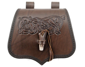 Early medieval, leather, bow-shaped belt pouch with viking ornament.