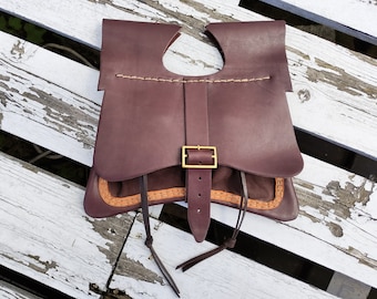 Medieval bag with suede drawstring pouches, fastened with a buckle.