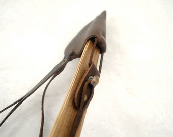 Bow tip protector and bowstring holder - made of leather