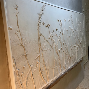 large  plaster bas-relief casting consists of blue wonder, vervain, anemones, verbena,purpletop, wildgrasses and sage 43X21 1/2 white