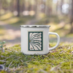 May include: White enamel mug featuring a teal green and white daisy design. The mug displays a quote from Rumi: "You are not a drop in the ocean. You are the entire ocean in one drop."