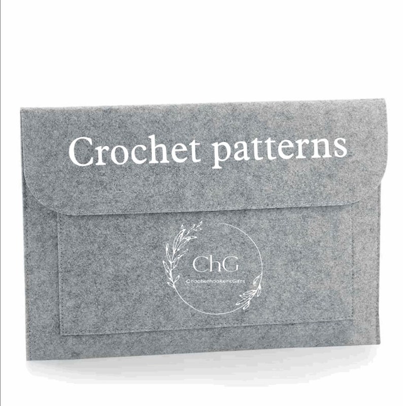 May include: Grey felt envelope with a white label that says "Crochet patterns". The envelope has a smaller pocket with a white logo that says "ChG Crochet Hookers Gifts" in a circle.