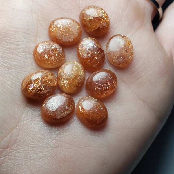 Beautiful lot of 10 Small oval Confetti Sunstone Cabochons!  grams. 11mmx9mm Accents. Jewelry making supplies.  Metaphysical. Ring size 1