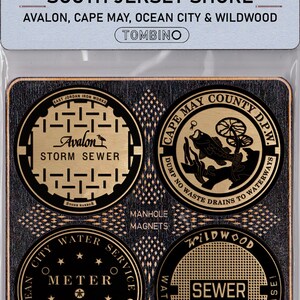 May include: Four gold-colored manhole cover magnets featuring designs from different towns on the South Jersey Shore. The magnets feature the text "Avalon Storm Sewer", "Cape May County D.P.W. Dump No Waste Drains To Waterways", "Ocean City Water Service Co. Meter The Ford Meter Box Co. Wabash Ind.", and "Wildwood Sewer Watch The Tramcar Please!"