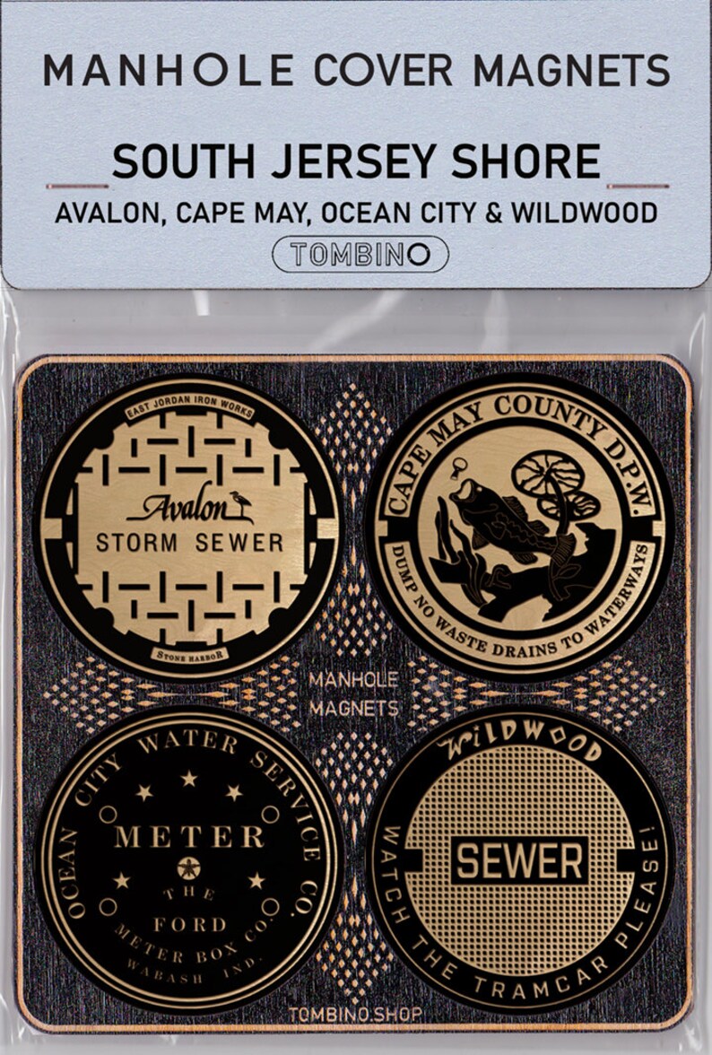 May include: Four gold-colored manhole cover magnets featuring designs from different towns on the South Jersey Shore. The magnets feature the text "Avalon Storm Sewer", "Cape May County D.P.W. Dump No Waste Drains To Waterways", "Ocean City Water Service Co. Meter The Ford Meter Box Co. Wabash Ind.", and "Wildwood Sewer Watch The Tramcar Please!"