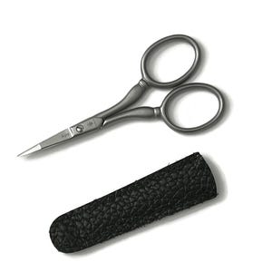May include: Silver-toned small scissors with a black leather case. The scissors have a curved handle and a small, sharp blade.