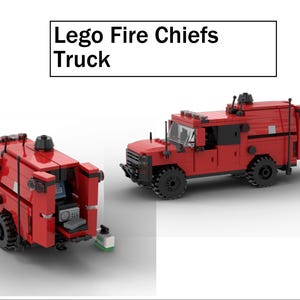May include: Two red Lego fire chief trucks are shown. The trucks have black wheels and aerials. One truck has an open back with a computer and other equipment. The text "Lego Fire Chiefs Truck" is above the trucks.