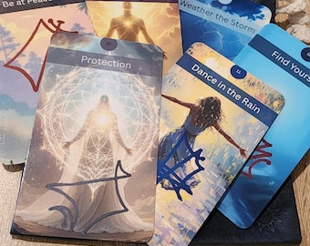 May include: A collection of oracle cards with various illustrations and text. The cards feature images of figures, landscapes, and abstract designs. Text on the cards includes phrases like "Be the Light," "Protection," and "Dance in the Rain." The cards are partially visible, fanned out, and placed on a wooden surface.