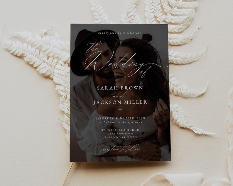 May include: Wedding invitation with a black background and a photo of a couple in the center. The text reads "The Wedding of Sarah Brown and Jackson Miller" with the date and location below.