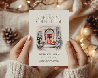 May include: A cream-colored Christmas Open House invitation. The invitation features a watercolor illustration of a house with a red door and Christmas decorations. The text reads "CHRISTMAS OPEN HOUSE" and includes the date, time, and RSVP information.