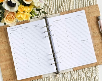 May include: A white A5 size planner with a clear plastic binder. The planner has a weekly layout with a separate section for each day of the week. The planner is open to December 2024 and January 2025.