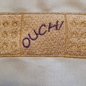 AUCH! Bandaid Maschinenstickerei Design