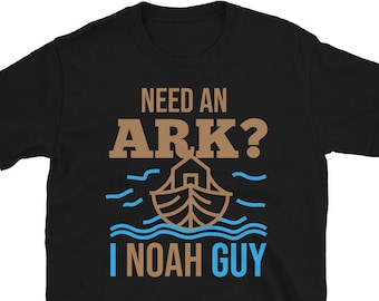 May include: Black t-shirt with a brown graphic of a boat with the text "Need an Ark? I Noah Guy" in brown and blue.