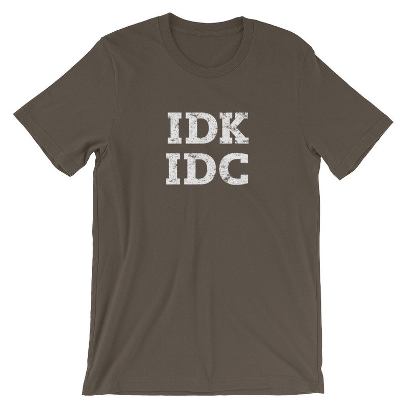May include: A dark brown t-shirt with a white distressed graphic that says "IDK IDC".
