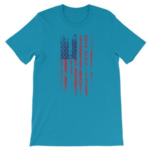May include: A turquoise blue t-shirt featuring a distressed American flag design and the text "DRAG RACIN'" in red.