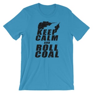May include: A turquoise blue t-shirt with a black graphic print that says "Keep Calm and Roll Coal". The graphic also includes a black silhouette of a train engine with smoke coming out of the chimney.