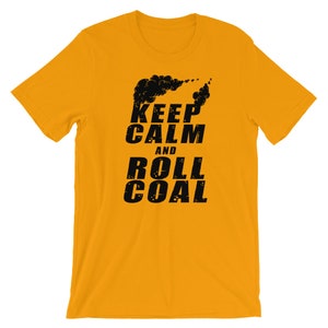 May include: A yellow t-shirt with black text that reads "Keep Calm and Roll Coal". The text is in a distressed font and is accompanied by a black graphic of a train engine's smoke plume.