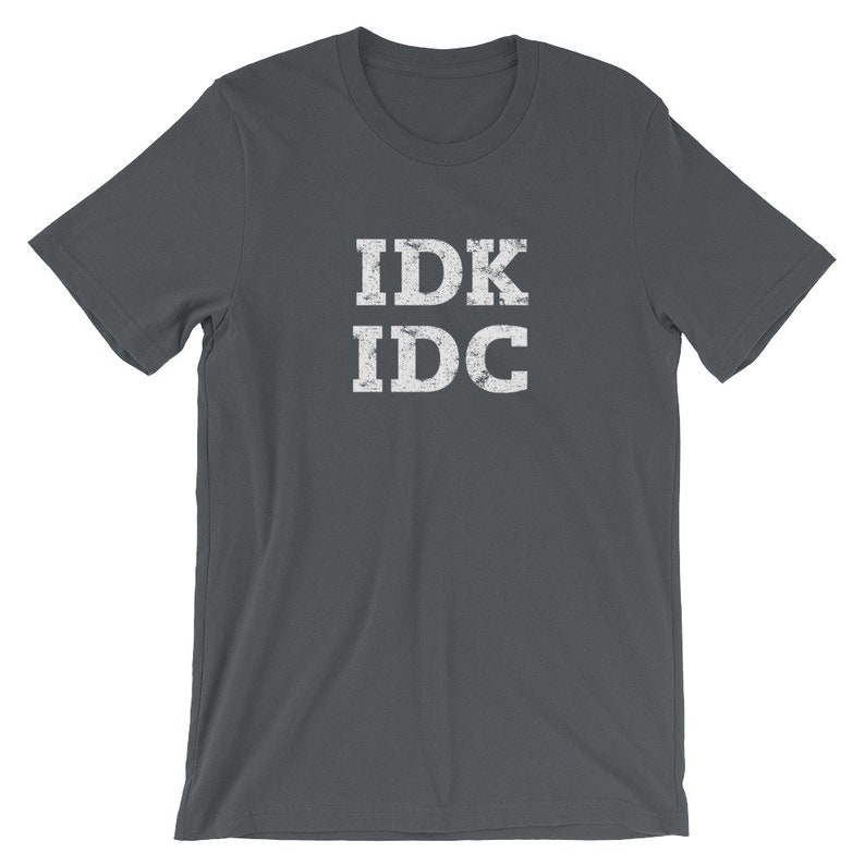 May include: Dark gray t-shirt with white text that reads "IDK IDC" in a distressed font.