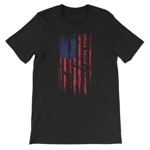 May include: Black t-shirt featuring a distressed American flag design and the text "DRAG RACIN'" in red.