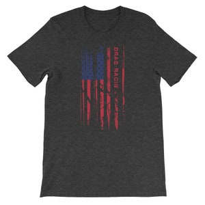 May include: A dark heather grey t-shirt featuring a distressed American flag design with the text "DRAG RACIN'" printed vertically on the right side of the flag.