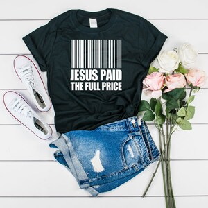 May include: Black t-shirt with a white barcode and the text "JESUS PAID THE FULL PRICE".