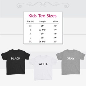 May include: Kids tee shirt size chart with measurements in inches.  The chart shows sizes XS, S, M, L, and XL with corresponding length and width measurements.  Three tee shirts are shown in black, white, and gray.