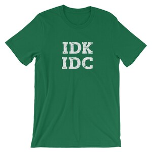 May include: A green t-shirt with the text "IDK IDC" in white distressed lettering.