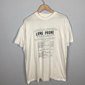 ヴィンテージ ロング プロング ヴァージン 1990 年代 アメリカン T シャツ ヴィンテージ チャート ロング プロング チャート テーブル グラフ グラフィック T シャツ ホワイト サイズ XL