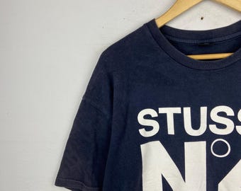 STUSSY CUSTOMADE N°4 Tシャツ STUSSY×CUSTOMADE】USA製カスタメイド NO.4 黒Tシャツ - メルカリ
