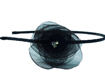 Headband flower with three rhinestone in the Center. Black