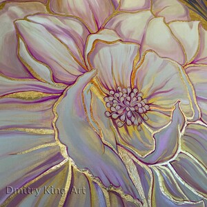 May include: A close-up of a painting of a large, white flower with gold accents. The flower has a pink center and is surrounded by other flowers.