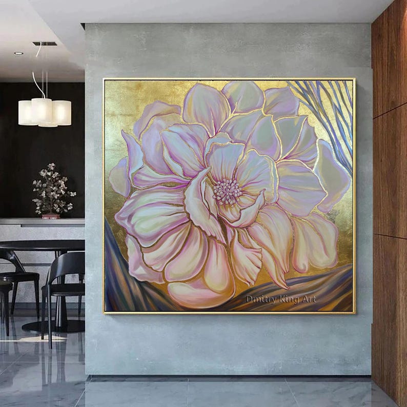 May include: A large, abstract painting of a pink flower with gold accents. The flower is painted in a realistic style and has a soft, delicate look. The background is a gold color and has a textured look. The painting is signed "Dainty King Art" in the bottom right corner.