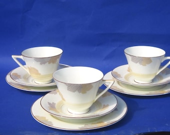 9 piece Royal Doulton Art Deco Tea Trio: 1935 Athlone Pattern, Fairy Shape