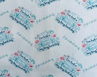 May include: A white fabric featuring a repeating pattern of blue line-art illustrations of a sofa, a coffee cup, and a slice of pizza, with the text "OKAY, I've had a very long hard day" and "F.R.I.E.N.D.S." printed in blue and red accents.