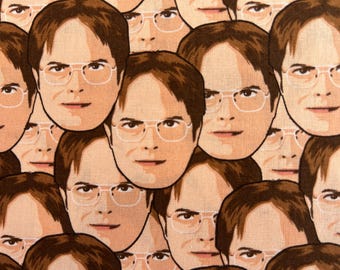May include: A fabric pattern featuring a repeating graphic illustration of a man with brown hair and glasses. The design consists of multiple faces of the same individual arranged in a dense, overlapping layout across the entire textile surface.
