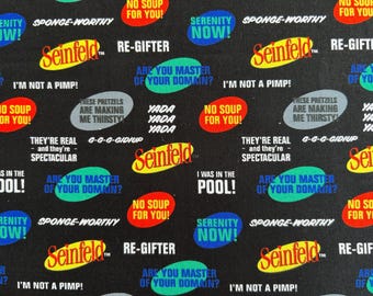 May include: Black fabric featuring a repeating pattern of Seinfeld logos and iconic show quotes including No Soup For You, Serenity Now, Sponge-Worthy, Re-Gifter, Are You Master Of Your Domain, I'm Not A Pimp, Yada Yada Yada, and I Was In The Pool.