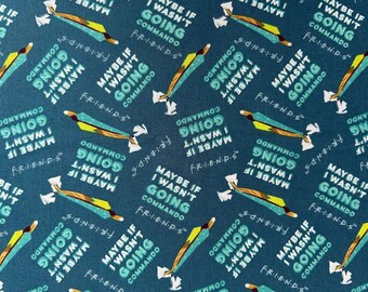 May include: A dark teal fabric featuring a repeating pattern of the text "MAYBE IF I WASN'T GOING COMMANDO" in light blue and white, accompanied by the "F.R.I.E.N.D.S." logo and small illustrations of a yellow and blue sandwich.