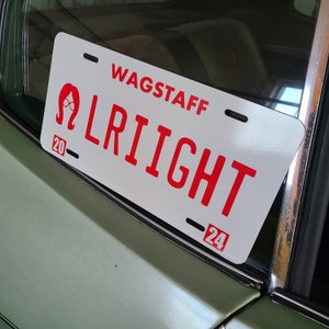 Bobs Burgers fan.  Linda, Alright saying!, metal reflective License plate.  Wall decor.