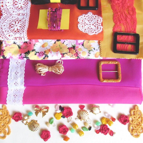 Sicilian style sewing kit of fabrics, buttons, trimmings, buckles and lace edges.