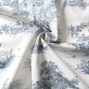 Toile de jouy in pure cotton with blue print on a natural white background. Cotton fabric for fashion and home accessories.