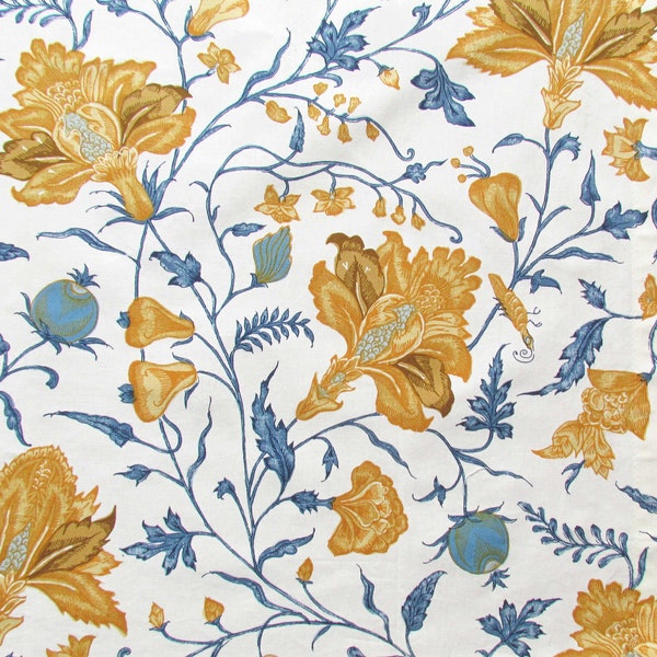 Remnant of furnishing fabric printed with elegant floral motifs and golden frame.