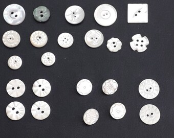 Antique dark coloured mother of pearl waistcoat buttons k with stamped detail have brass loop shank 12 dia