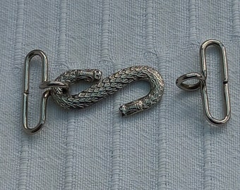 Snake belt buckle. Good condition. Snake 4.2cm long. Buckle approximately 6.5cm in total. Two small (hard to see) marks on scales. No maker.