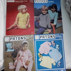 May include: Four vintage knitting pattern booklets from Patons featuring baby clothing designs. The patterns include a beehive baby dress, a double knit sweater, a fairytale cardigan and a set of three jackets for babies.