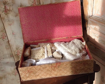 large antique fabric box with a huge lot of lace