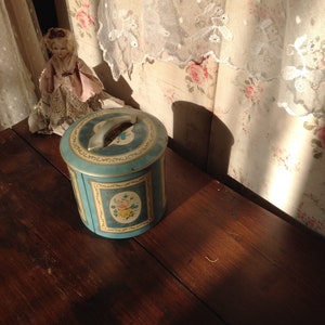 old blue little tin, floral storage box