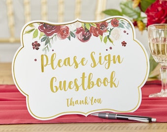 May include: White sign with a gold border and floral design. The sign says "Please Sign Guestbook Thank You".