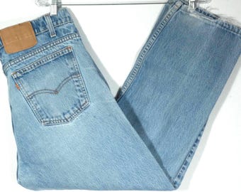 Vintage Levi's jeans met oranje lipje, distressed short / boyfriend-pasvorm - maat 35 x 26