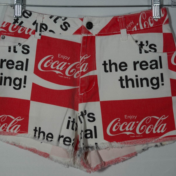 Coca-Cola Red & White Shorts Vintage Cutoffs Cut Graphic Print "It's the Real Thing" Cotton Denim Fringe Hem -  Mid Rise Size S, 28" Waist